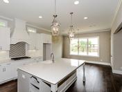 White Cabinets with Custom Decorator Design at Provence by Waterford Homes at Regency Point